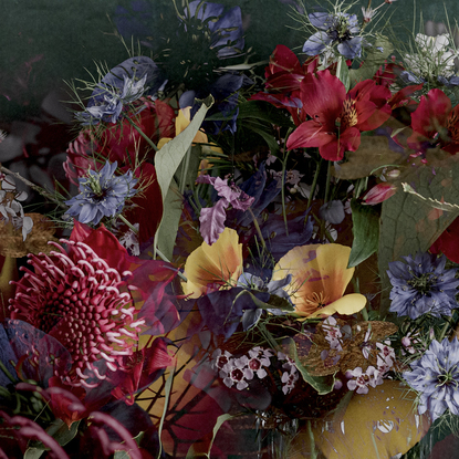 Floral bouquet with vintage glass vase.