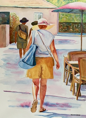 Woman walks along the street.