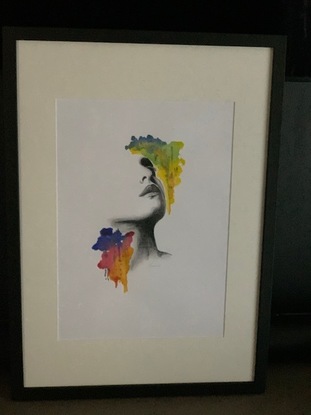 A drawing of a beautiful woman deep in thought with pops of bright colors to accentuate her facial features