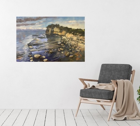 Oil painting of the  Skillion at the Haven Terrigal.   This large rock formation rises above the rock platforms, that are covered with the rising tide.    Blue is the dominant colour of the sea in the background, sky and flowing water over the rocks.