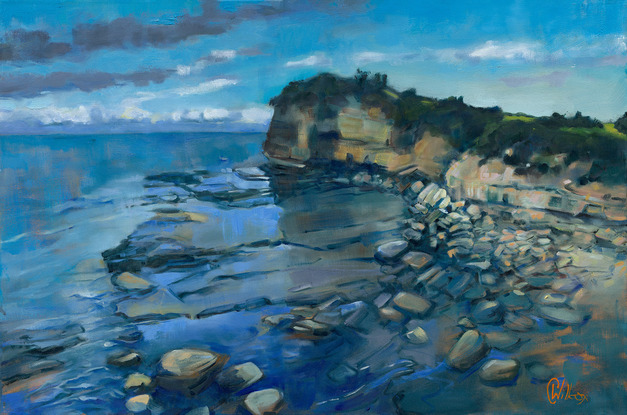 Oil painting of the  Skillion at the Haven Terrigal.   This large rock formation rises above the rock platforms, that are covered with the rising tide.    Blue is the dominant colour of the sea in the background, sky and flowing water over the rocks.