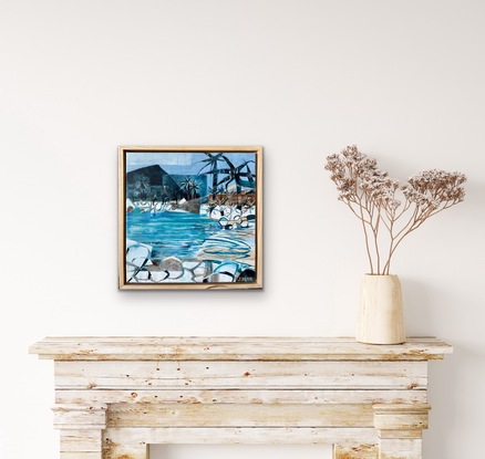 Beach scene with rocks and palms.