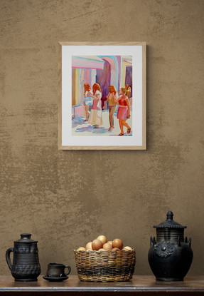 Women walking through an urban street basked in sunshine.