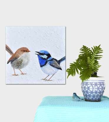 A thickly textured painting of two Superb Fairy Wrens on a white painted background. One, a brown female and the other a brilliant blue male.