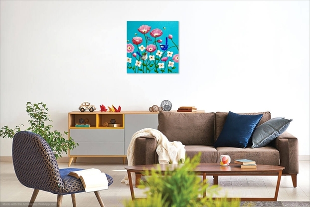 A group of happy pink poppies and smaller white flowers against a turquoise background. The poppies have open happy faces and a splendid blue wren and its mate relax on the stems of the poppies. A dragonfly rests on another stem and three litte bees hover between the flowers looking for nectar. The colours are largely turquoise, pink, white, blue and some yellow. The painting is framed in a white box frame.