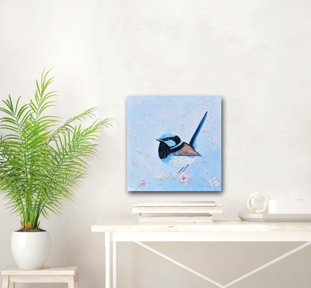 Thickly textured oil painting of a Superb Fairy Wren perched on a blossom branch. 