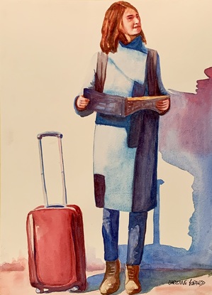 Woman waiting with her suitcase.