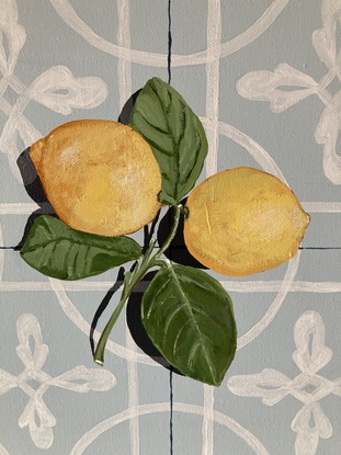 Two lemons, attached to their stems and resting on a powder blue encaustic tile background, accented by a contrasting shadow