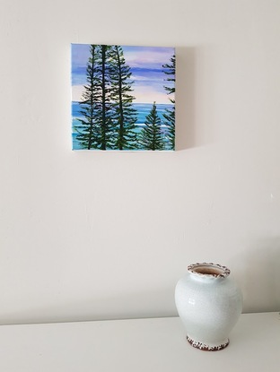 Norfolk Island pines turquoise waves sunset sky beach