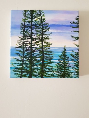 Norfolk Island pines turquoise waves sunset sky beach