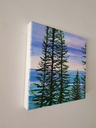 Norfolk Island pines turquoise waves sunset sky beach