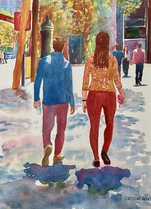 Couple walking in the shade of trees. 