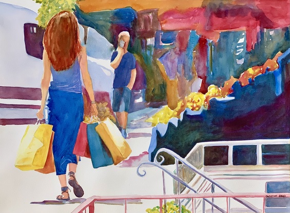 Woman walks with her shopping bags.