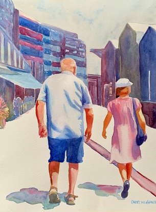 A couple walking in the Walsh Bay Wharves Precinct.