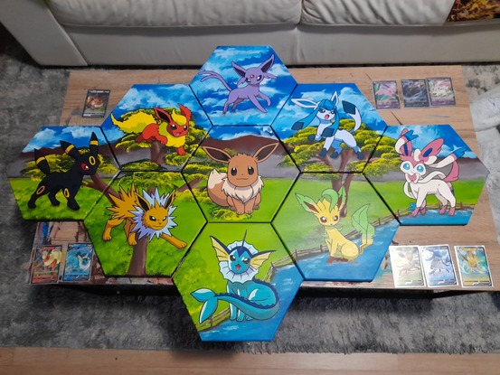 The Eevee Evolution set of all the Eevee characters overlaid onto a 9 set hexagon series with a mountain landscape background.