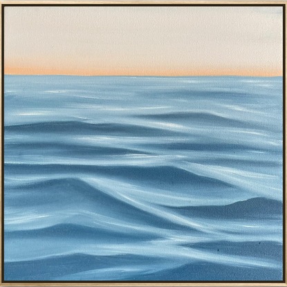 Ocean surface ripples under a setting sky