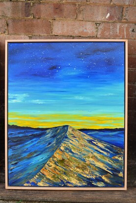 Painting of a landscape, a blue desert from the night sky, with the sun rising at the horizon, reflecting the golden sand.