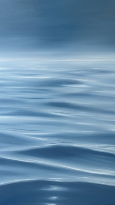 Ocean ripples under a dark grey sky