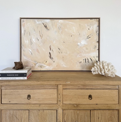 An abstract piece that combines soft and bold strokes. Similar to a sandy beach scattered with driftwood and patterns left by the tide.