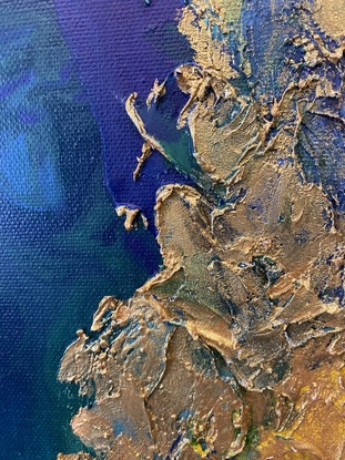 Aerial view of ocean with textured gold.