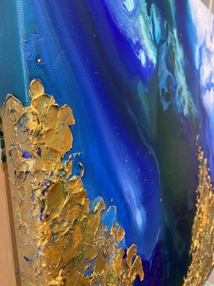 Aerial view of ocean with textured gold.