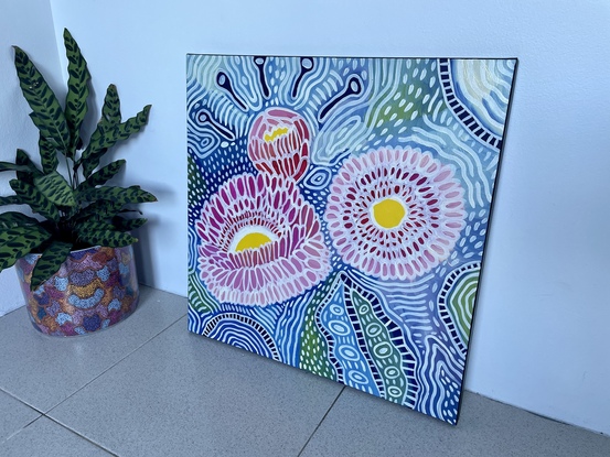 Flowering gum in pink and yellow on blue patterned background 