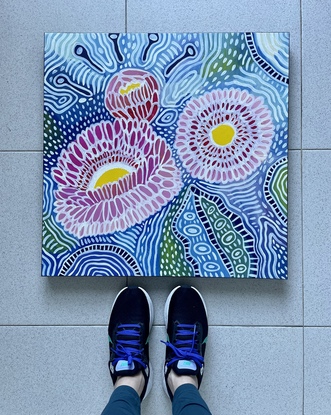 Flowering gum in pink and yellow on blue patterned background 