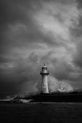 
Fortunate to be at Belmore Basin Wollongong on a moody/rather rugged day when waves were big and crashing around the lighthouse . Black & white creates an accurate record of the environment that day.