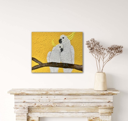 White cockatoo couple on bright yellow background