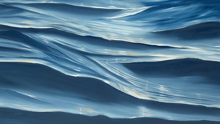 Ocean swell with a vantage point of swimming at sunrise