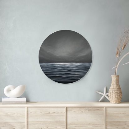 Ocean with waves and a moody gray cloudy sky