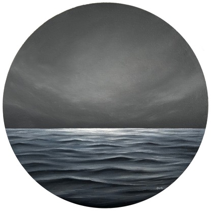 Ocean with waves and a moody gray cloudy sky