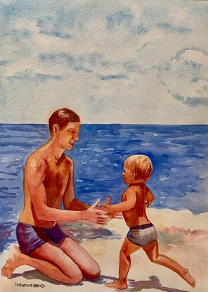 Father and child play on the beach.