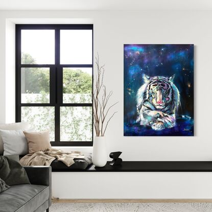 White Tiger lying crossed legs with closed eyes on cosmic background