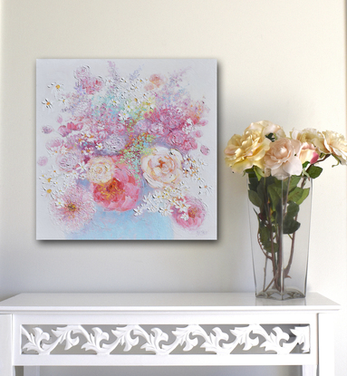 A thickly textured still life oil painting of spring flowers, peonies and roses in a blue vase.