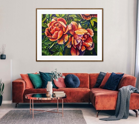 Colourful red, orange and peach summer peonies on background greenery.