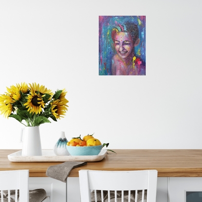 Bold coloured portrait of a young lady, laughing and getting splashed with colourful paint