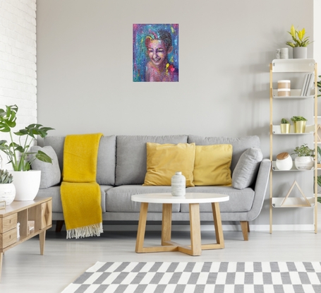 Bold coloured portrait of a young lady, laughing and getting splashed with colourful paint