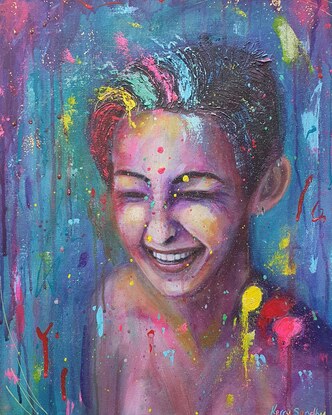 Bold coloured portrait of a young lady, laughing and getting splashed with colourful paint