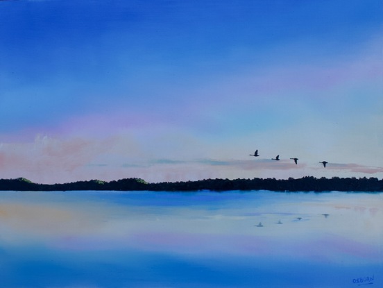 This is an early morning, sunrise scene of the estuary with orange, magenta and pale blues in the sky and reflections. There are also 4 black swans flying in the sky.