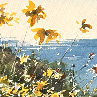 A beach scene with sunlight glistening on the water,  beach scrub and orange flowers in the foreground.