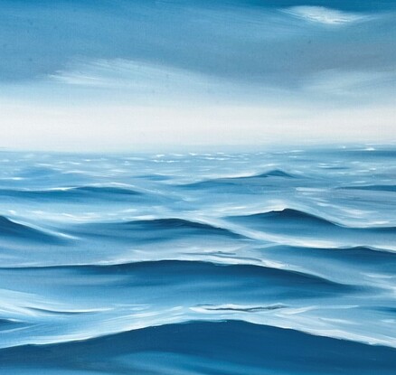 Deep ocean swell on surface under a gray sky