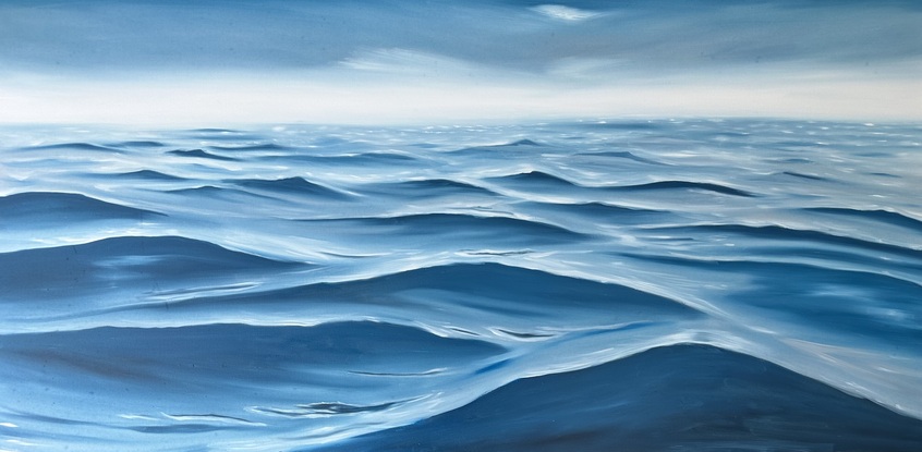 Deep ocean swell on surface under a gray sky