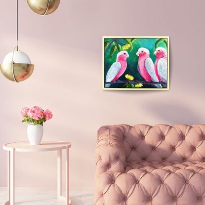 An oil painting of three pink galahs on a branch.