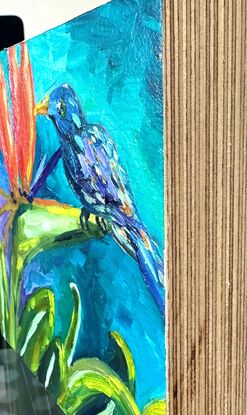 Small painting of a bird on a Bird of Paradise.