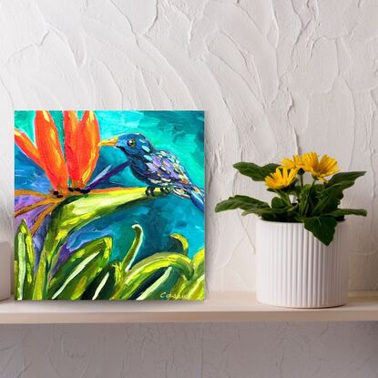 Small painting of a bird on a Bird of Paradise.