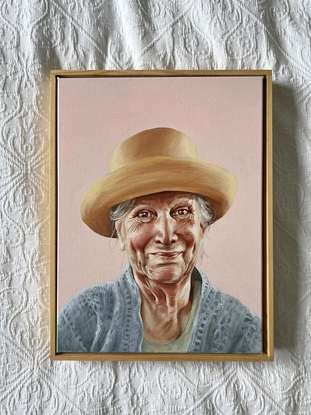 woman in yellow hat on pink background