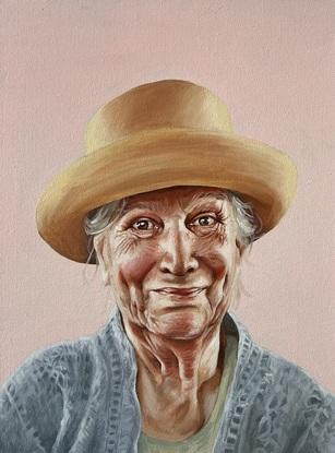 woman in yellow hat on pink background