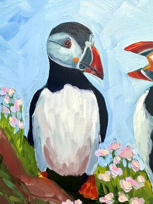 An oil painting of two puffins.