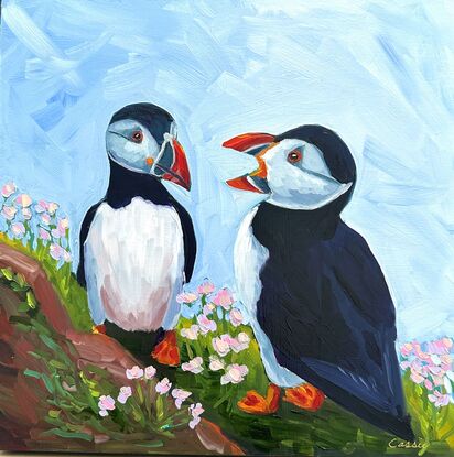 An oil painting of two puffins.